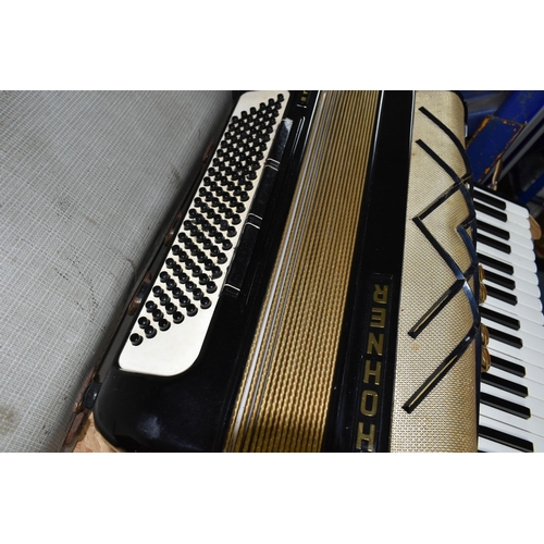 411 - A CASED HOHNER VIRTUOLA III 'PIANO ACCORDION', in black finish with 120 bass and 5 treble couplers, ... 