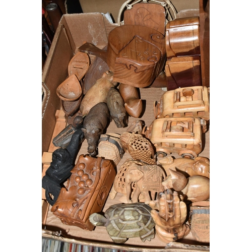 439 - THREE BOXES OF TREEN ITEMS, to include carved animals, Indian puzzle boxes in the form of a sleeping... 