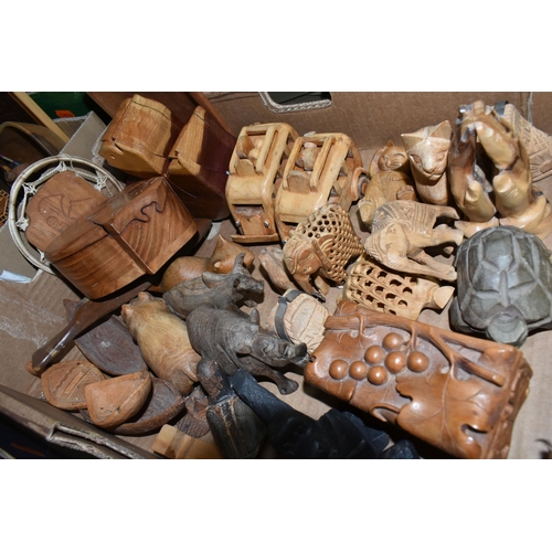 439 - THREE BOXES OF TREEN ITEMS, to include carved animals, Indian puzzle boxes in the form of a sleeping... 