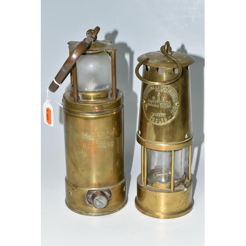 446 - TWO BRASS LAMPS, a McGeoch 0583 900-4090 brass lamp with looped hook handle, possibly a submarine/sh... 