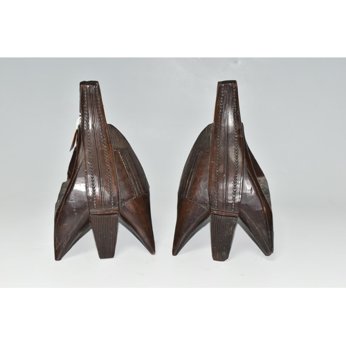 466 - A PAIR OF WOODEN STIRRUPS, carved with patterns, each with six wooden 'legs', approximate measuremen... 