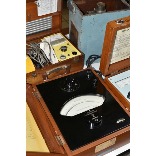 515 - FOUR WOODEN CASED MID-CENTURY ELECTRICAL MEASURING INSTRUMENTS, comprising a Bridge 'Megger' testing... 