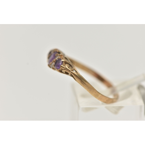 18 - A 9CT GOLD AMETHYST AND CUBIC ZIRCONIA RING, set with three circular cut amethysts, flanked with fou... 