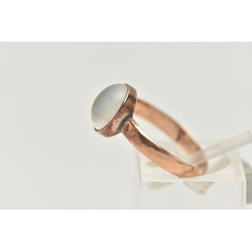 38 - A MOONSTONE SINGLE STONE RING, set with an oval moonstone cabochon, rub over set with millegrain bor... 