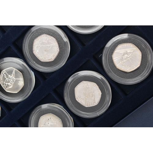 134 - A BOX OF ROYAL MINT COMMEMORATIVE SILVER 50 PENCE COINS, to include eleven coins, from the Olympic '... 