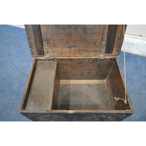 1307 - A GEORGIAN OAK BIBLE BOX, the hinged lid enclosing a candle box, once you remove a panel of wood, it... 