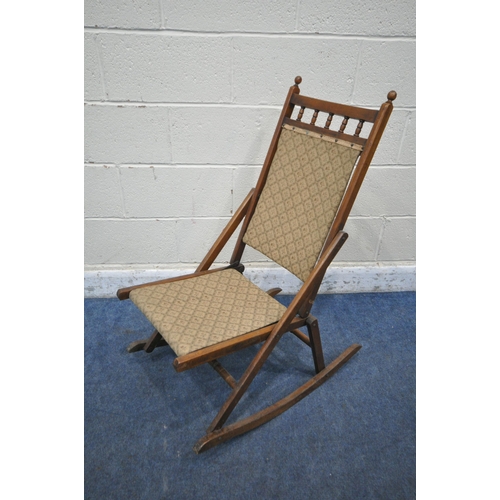 1309 - A 20TH CENTURY FOLDING ROCKING CHAIR, with beige fabric back and seat (condition report: surface mar... 