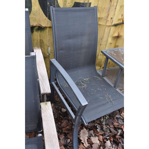 1020 - A MODERN METAL FRAMED CURVED GARDEN BENCH with raised two tier centre table and parasol holes in cen... 