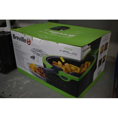 1127 - A BOXED AND UNUSED BREVILLE HALO HEALTH FRYER, an egl microwave, and a Russell Hobbs steamer (ALL UN... 