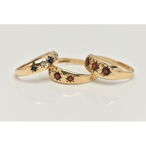 16 - THREE 9CT GOLD GEM SET RINGS, the first a gents three stone garnet ring with star setting detail, ha... 