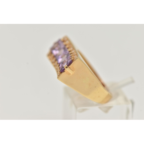 18 - A YELLOW METAL DRESS RING, a rectangular form mount with concave detail, set with four purple square... 