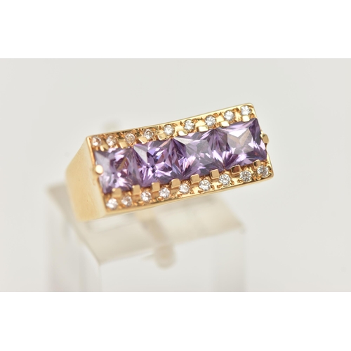 18 - A YELLOW METAL DRESS RING, a rectangular form mount with concave detail, set with four purple square... 