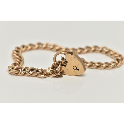 24 - A 9CT GOLD BRACELET, the curb link bracelet with heart padlock clasp, 9ct hallmark on clasp and brac... 