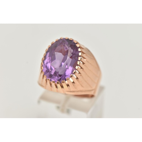 25 - A SYNTHETIC COLOUR CHANGE SAPPHIRE SIGNET RING, designed as an oval purple synthetic colour change s... 