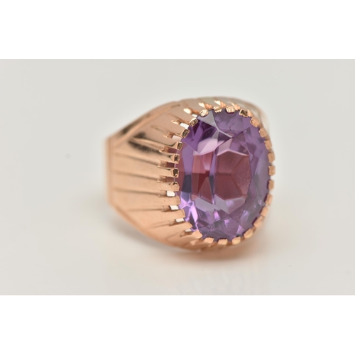 25 - A SYNTHETIC COLOUR CHANGE SAPPHIRE SIGNET RING, designed as an oval purple synthetic colour change s... 