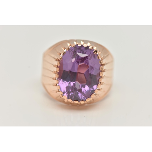 25 - A SYNTHETIC COLOUR CHANGE SAPPHIRE SIGNET RING, designed as an oval purple synthetic colour change s... 