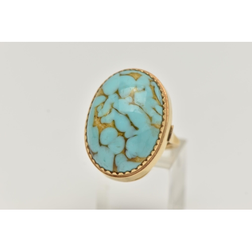 28 - A GLASS CABOCHON RING, designed as an oval glass turquoise imitation cabochon, stamped 18ct, approxi... 