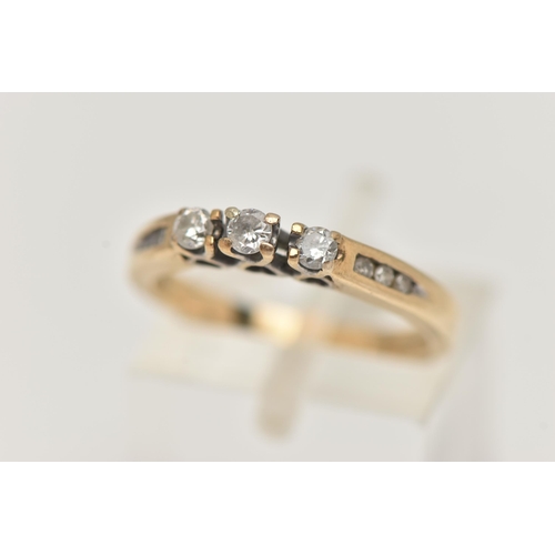 37 - TWO ITEMS OF JEWELLERY, to include a 9ct gold three stone diamond ring with diamond detail to the sh... 