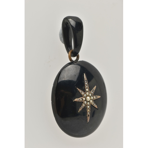 39 - A LATE VICTORIAN JET AND SEED PEARL PENDANT, of oval outline with central elongated star set with sp... 