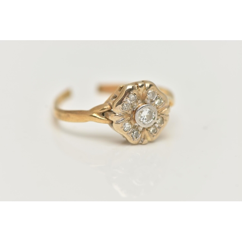 41 - A DIAMOND CLUSTER RING, AF, designed as a two tier cluster, the central brilliant cut diamond within... 