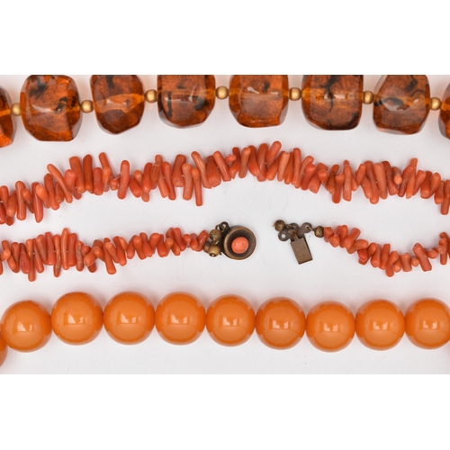 44 - FOUR NECKLACES, to include a branch coral necklace, a heated amber necklace, and two plastic bead ne... 