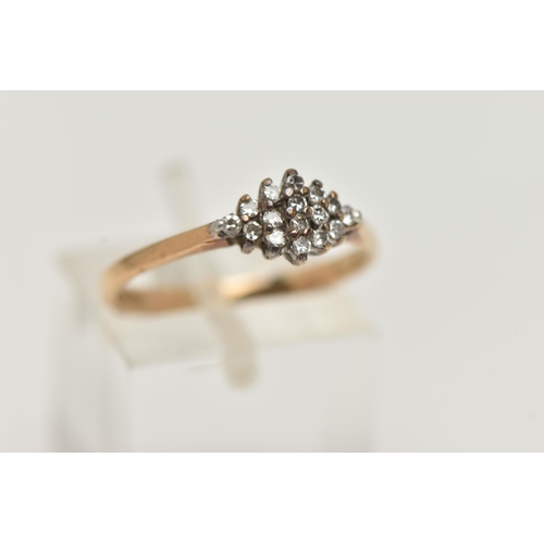 54 - A 9CT GOLD DIAMOND CLUSTER RING, the diamond shape tiered cluster claw set with single cut diamonds,... 