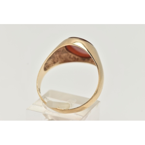 55 - A 9CT GOLD CARNELIAN SIGNET RING, the oval carnelian to the tapered plain band, 9ct hallmark for Lon... 