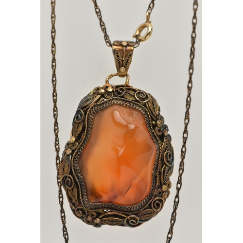 57 - A CONTINENTAL PENDANT, the Chinese style pendant designed as a polished agate within a floral and fo... 