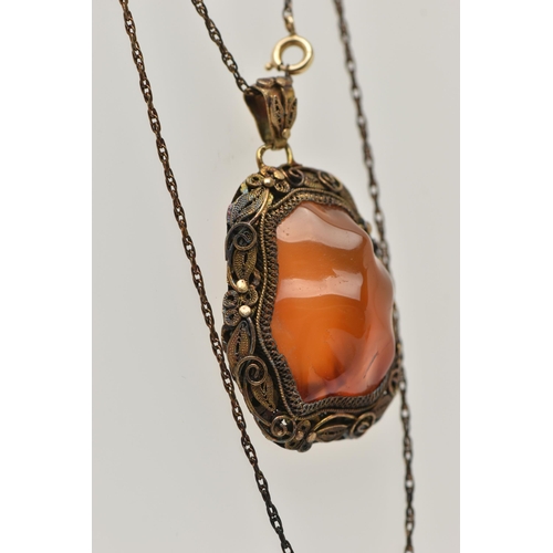 57 - A CONTINENTAL PENDANT, the Chinese style pendant designed as a polished agate within a floral and fo... 