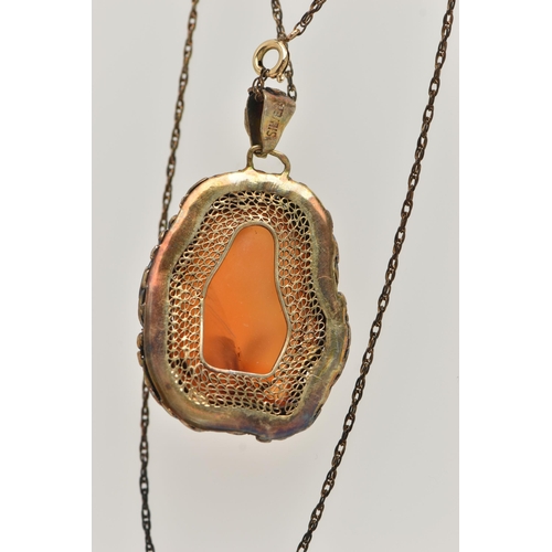 57 - A CONTINENTAL PENDANT, the Chinese style pendant designed as a polished agate within a floral and fo... 