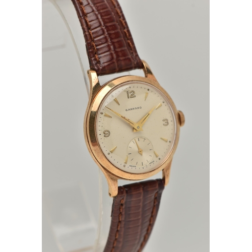 58 - A GARRARD 9CT WRISTWATCH, the circular face with baton and Arabic numerals, a subsidiary seconds dia... 