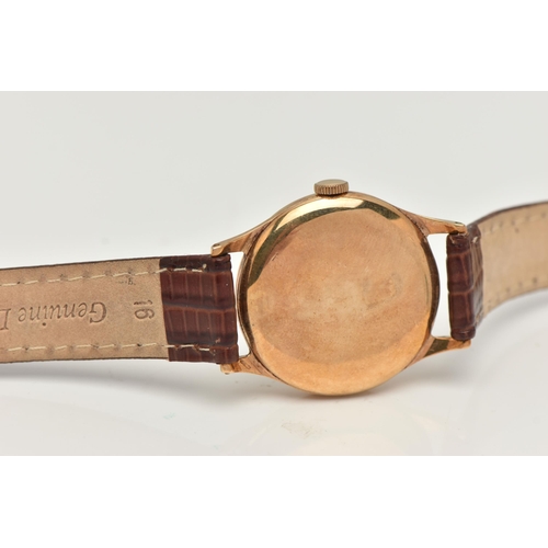 58 - A GARRARD 9CT WRISTWATCH, the circular face with baton and Arabic numerals, a subsidiary seconds dia... 