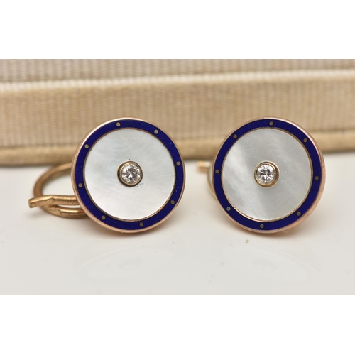 66 - A PAIR OF 9CT GOLD DIAMOND SET CUFFLINKS, each of a circular form, centrally set with a small round ... 