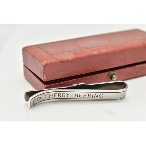 68 - A 'GEORG JENSEN' 'CHERRY HEERING' TIE CLIP, designed as a pair of cherries to the plain bar for the ... 