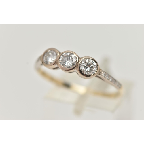 7 - A THREE STONE DIAMOND RING, three round brilliant cut diamonds bezel set in white metal, approximate... 