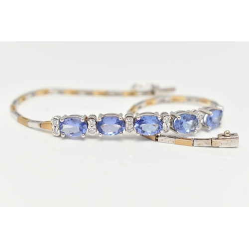 70 - A GEM SET BRACELET, comprised of five oval cut tanzanite interspaced with twelve round brilliant cut... 