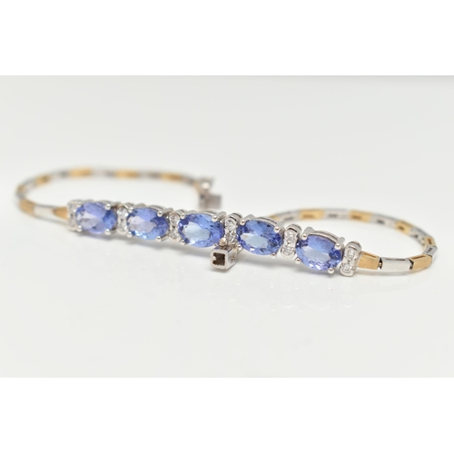 70 - A GEM SET BRACELET, comprised of five oval cut tanzanite interspaced with twelve round brilliant cut... 