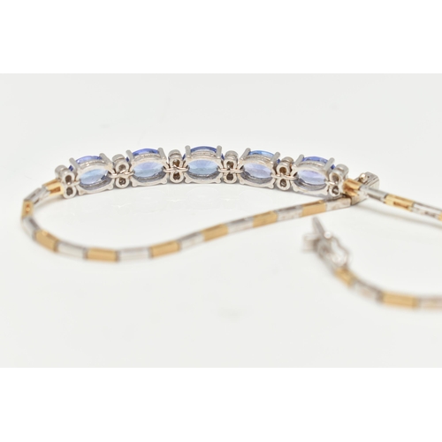 70 - A GEM SET BRACELET, comprised of five oval cut tanzanite interspaced with twelve round brilliant cut... 