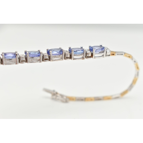 70 - A GEM SET BRACELET, comprised of five oval cut tanzanite interspaced with twelve round brilliant cut... 