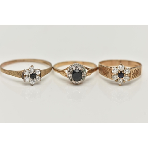 107 - THREE GEM SET RINGS, the first a sapphire and diamond cluster ring, hallmarked 9ct, ring size M, tog... 