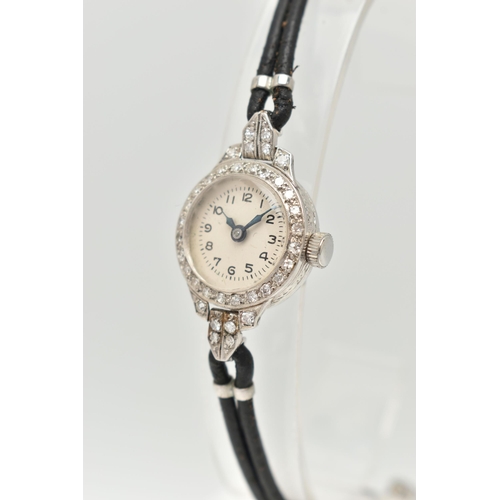 127 - A LADIES DIAMOND SET COCKTAIL WRISTWATCH, manual wind, round silvered dial, Arabic numerals, blue st... 