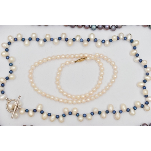 128 - THREE CULTURED PEARL NECKLACES, the first a single row of white cultured pearls with a pink hue, eac... 