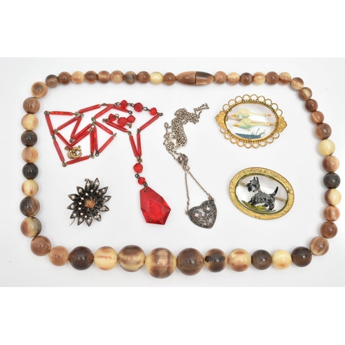 79 - SIX ITEMS OF JEWELLERY, to include a carved horn bead necklace with screw clasp, a red bead necklace... 