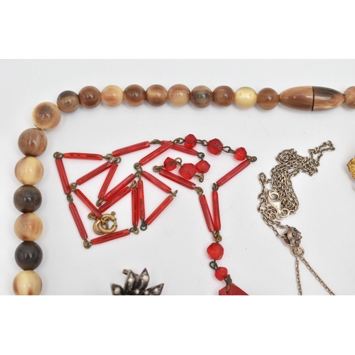 79 - SIX ITEMS OF JEWELLERY, to include a carved horn bead necklace with screw clasp, a red bead necklace... 