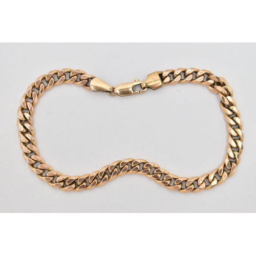 83 - A YELLOW METAL CURB LINK BRACELET, hollow links, fitted with a lobster clasp, stamped 9kt, length 21... 