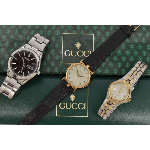 134 - THREE WRISTWATCHES, to include a ladies boxed 'Gucci' quartz wristwatch, stamped to the case back '3... 