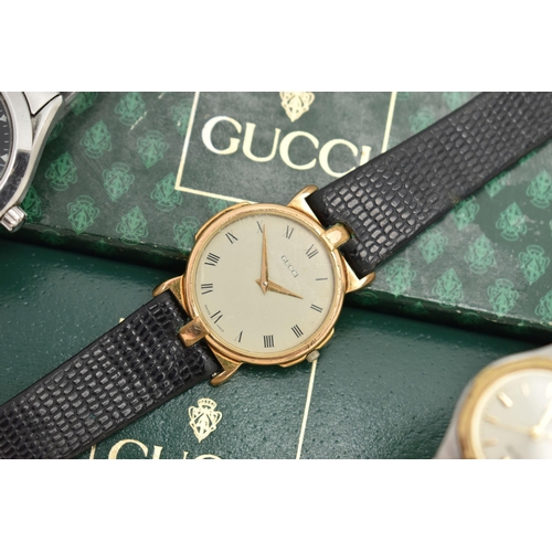 134 - THREE WRISTWATCHES, to include a ladies boxed 'Gucci' quartz wristwatch, stamped to the case back '3... 