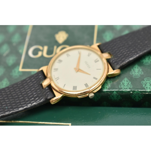 134 - THREE WRISTWATCHES, to include a ladies boxed 'Gucci' quartz wristwatch, stamped to the case back '3... 