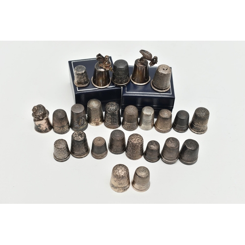 140 - A SELECTION OF SILVER THIMBLES, twenty-six thimbles in total, various designs and patterns, all with... 