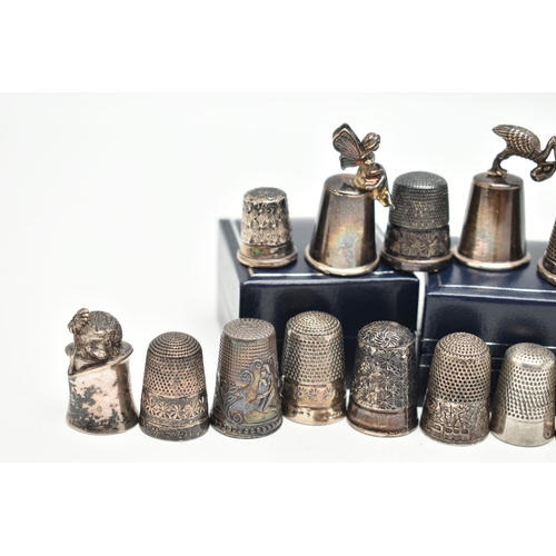 140 - A SELECTION OF SILVER THIMBLES, twenty-six thimbles in total, various designs and patterns, all with... 